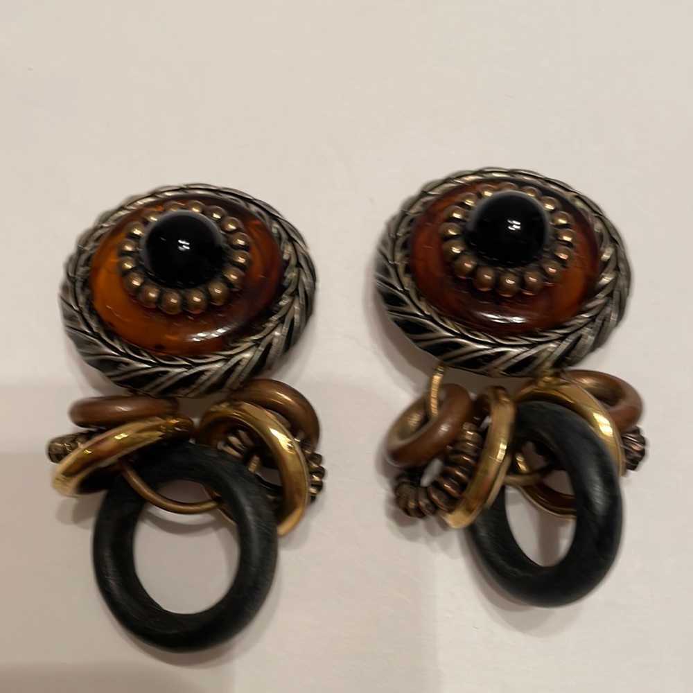 Dangling charm style earrings
